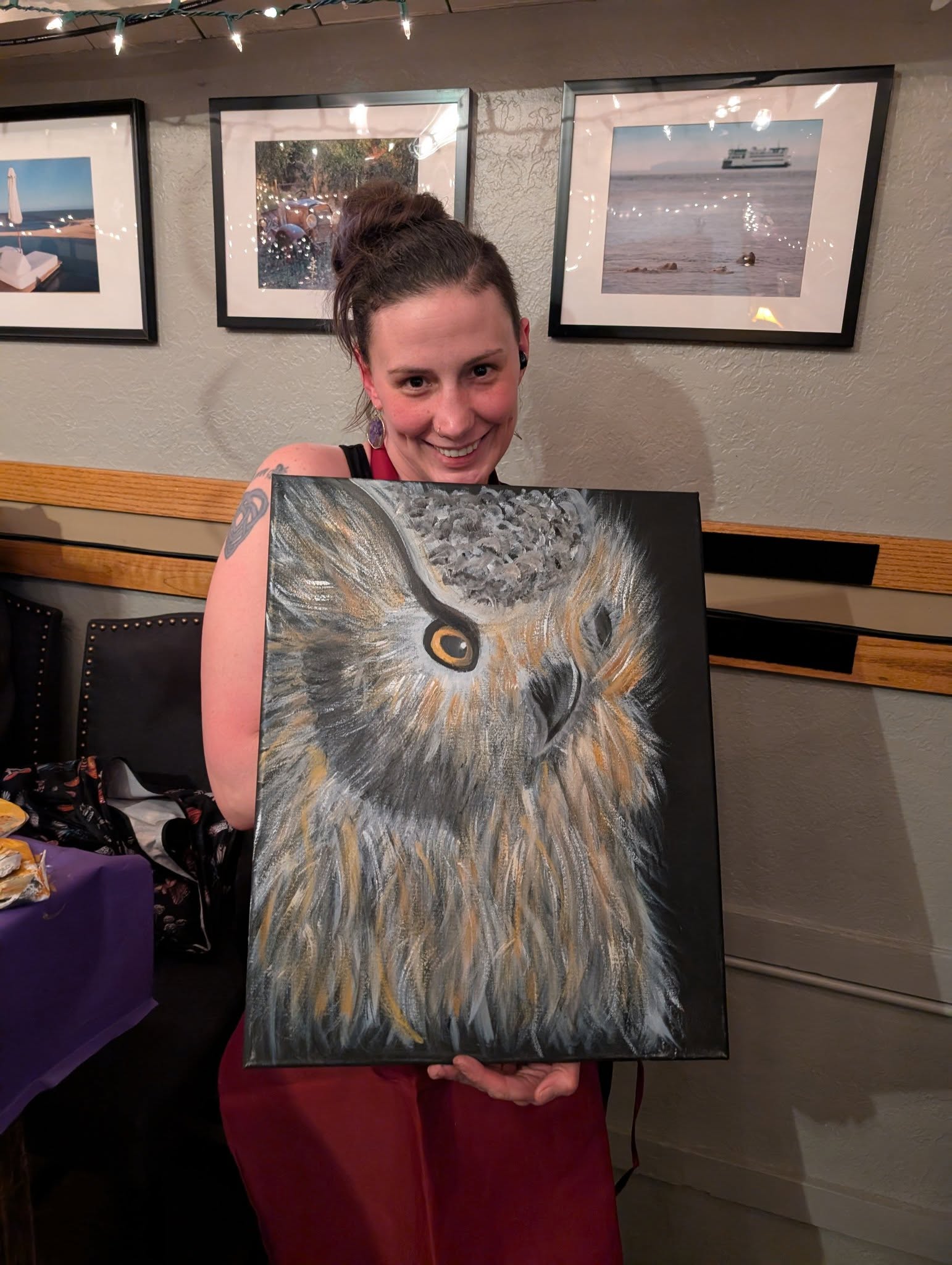 Guest holding an owl painting