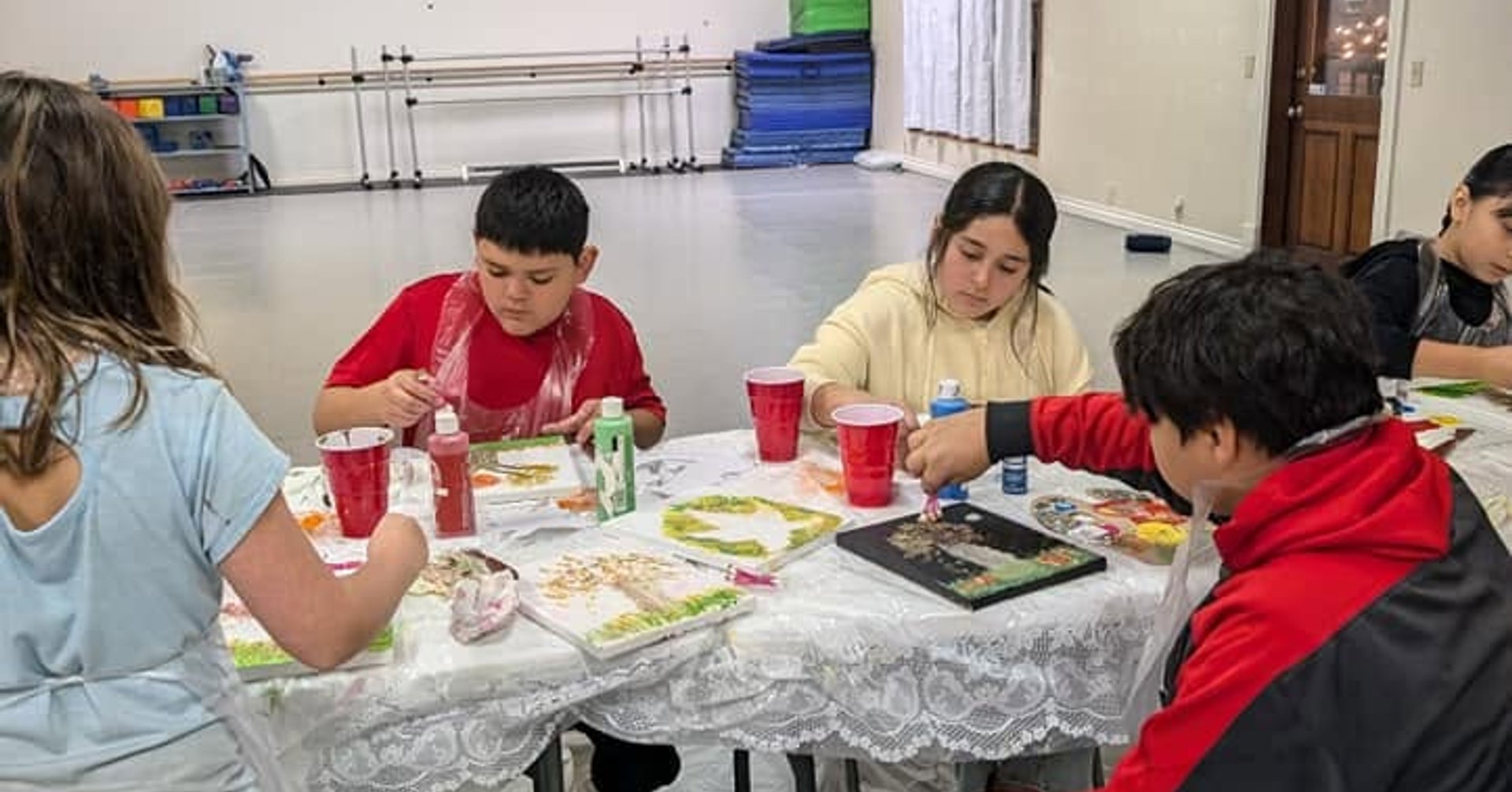Kids painting at a birthday paint party