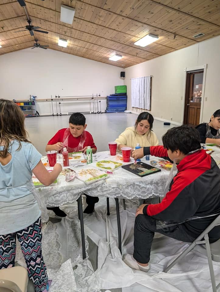 Kids painting at a birthday paint party